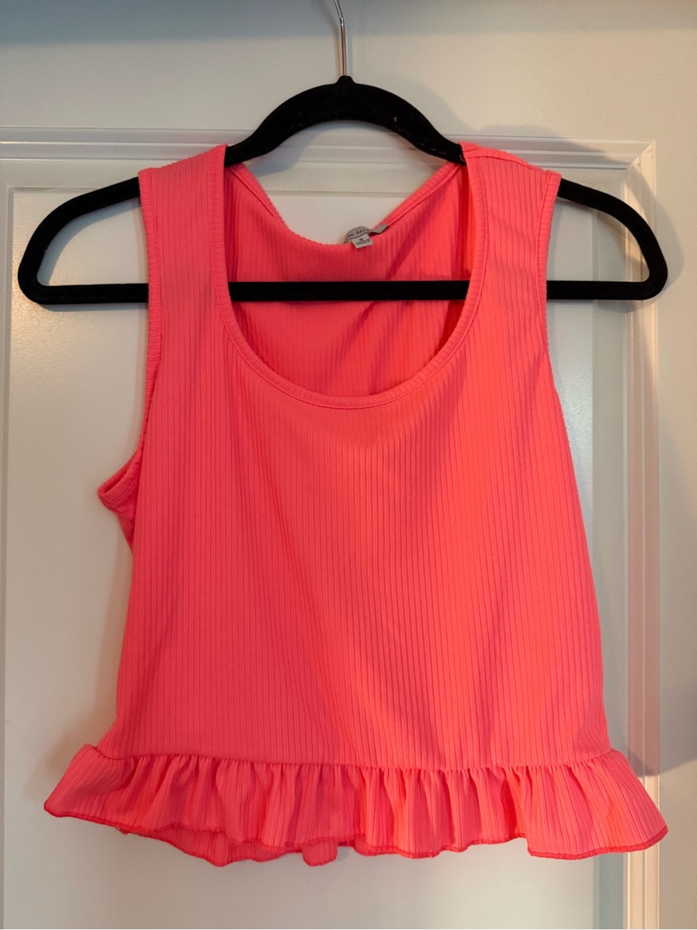 Bright pink ribbed tank with ruffle hem